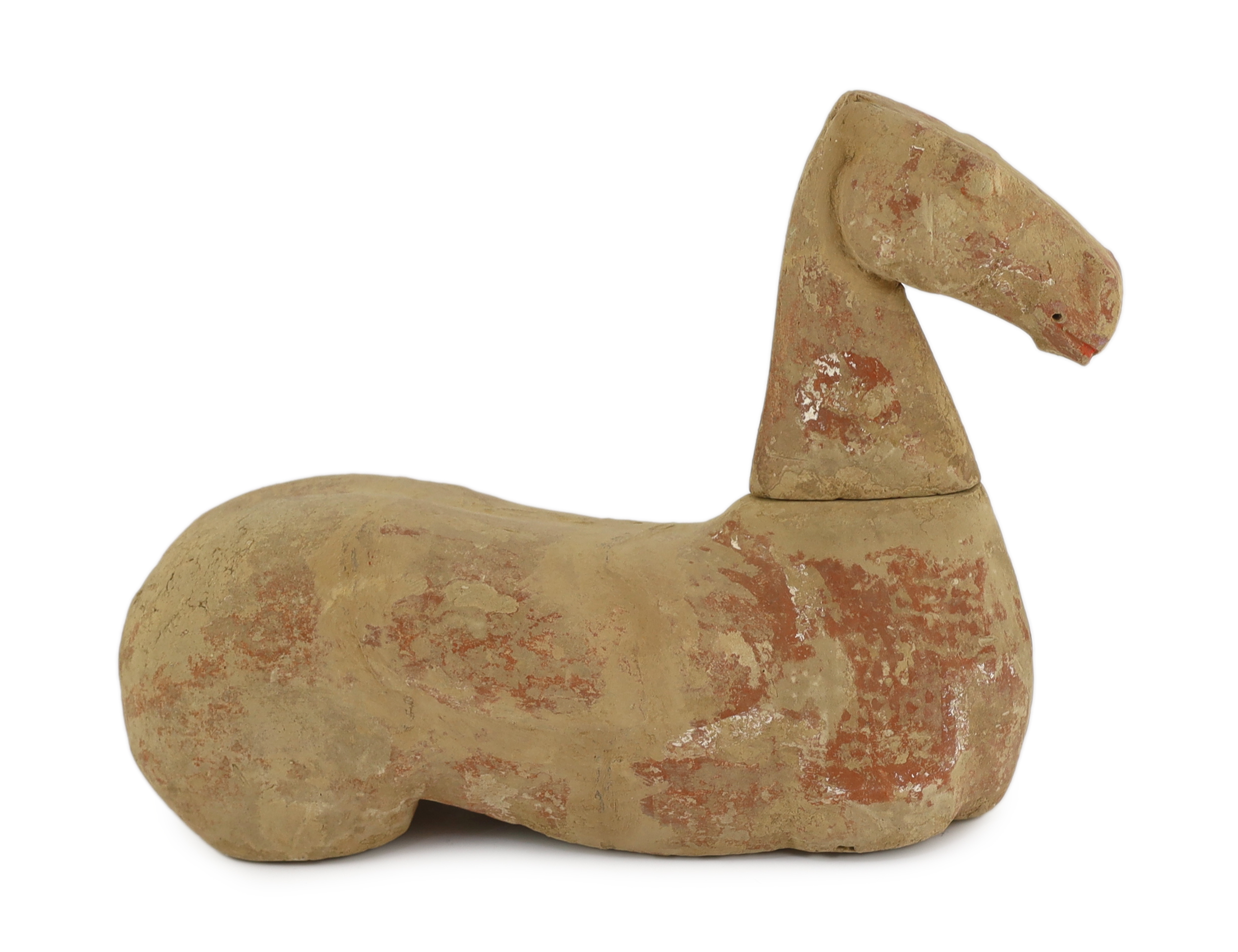 A Chinese buff pottery model of a horse, Han dynasty (206 BC-220 AD)